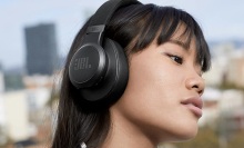 woman wearing jbl live 660nc headphones